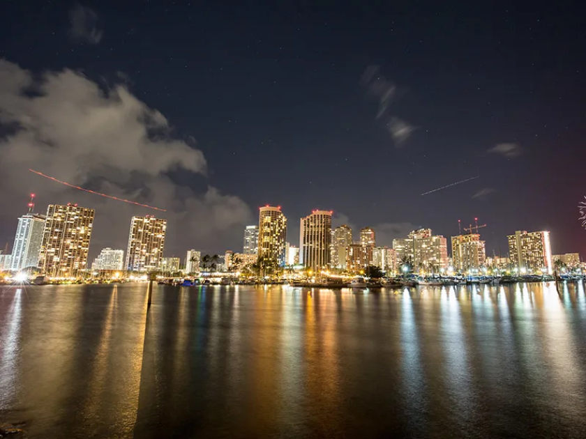 The stunning nighttime vistas offered by a late-night dinner cruise in Oahu.