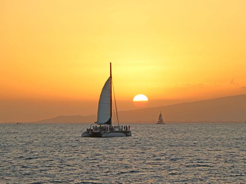 Makani Catamaran Honolulu Sunset Cruise with Open Bar & Transportation Service