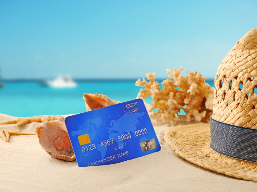 Credit card on holiday on blurred resort background