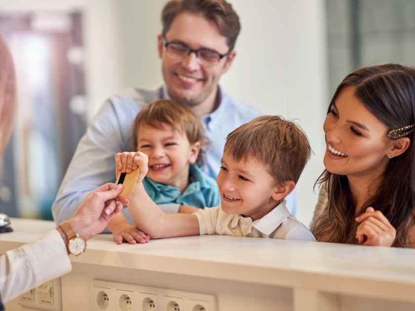 Picture of family checking in hotel