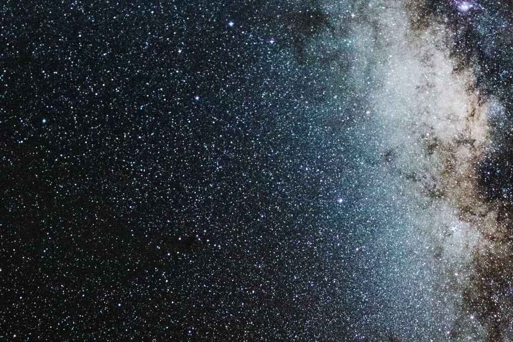 View of Milky Way solar system in night sky over volcanic pu'u hill on the slope of sacred Mauna Kea mountain in Hawaii