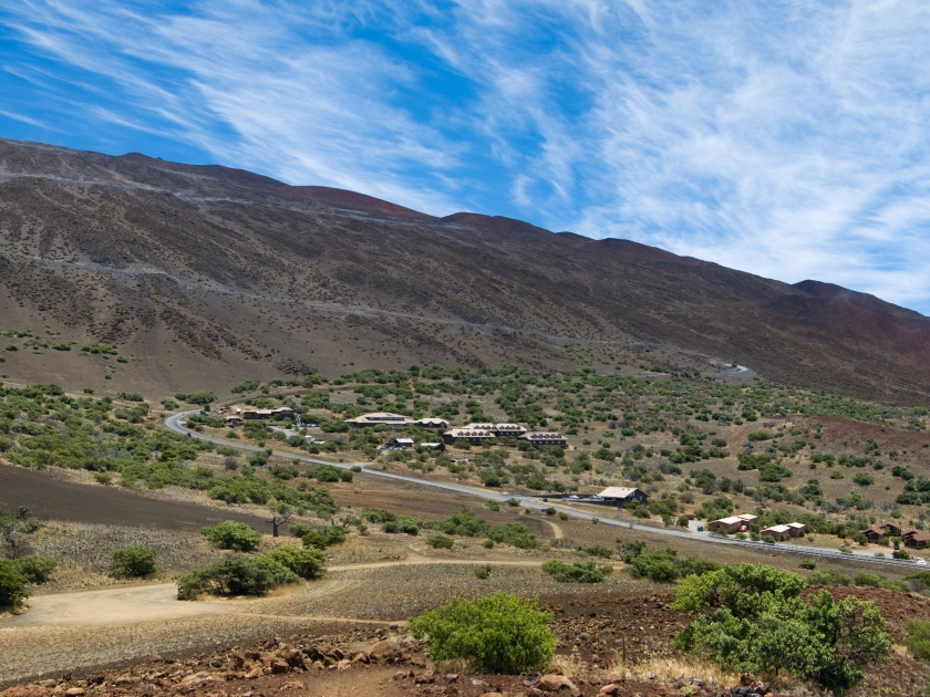 Part of the road leading to the observatories atop Mauna Kea along with the Onizuka Center for International Astronomy Visitor Information Station.