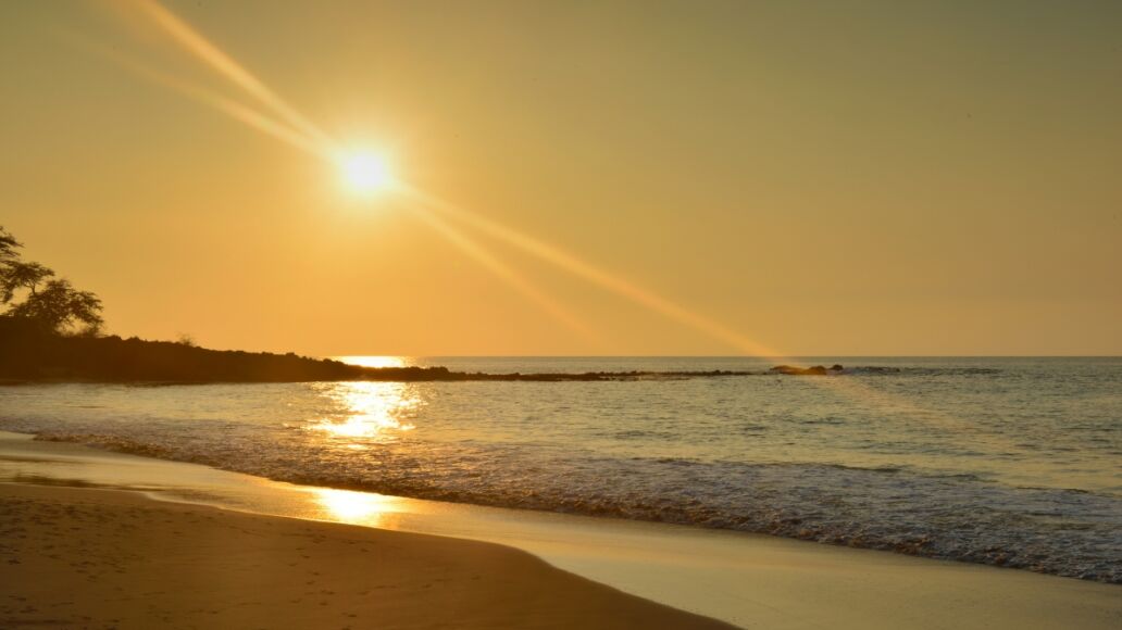 beautiful sunset at Mauna Kea beach Big Island of Hawaii