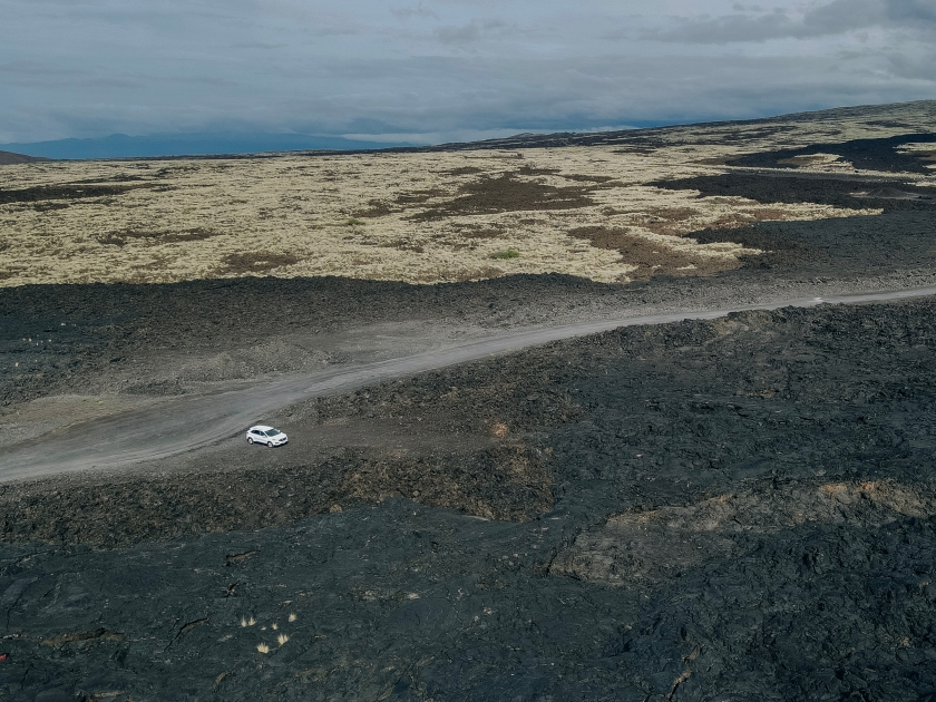 Chain of Craters Road in Hawaii Volcanoes National Park is vivid with blue ocean, waves and black sea cliffs. Cliffs were formed when Mauna Ulu exploded liquid lava.