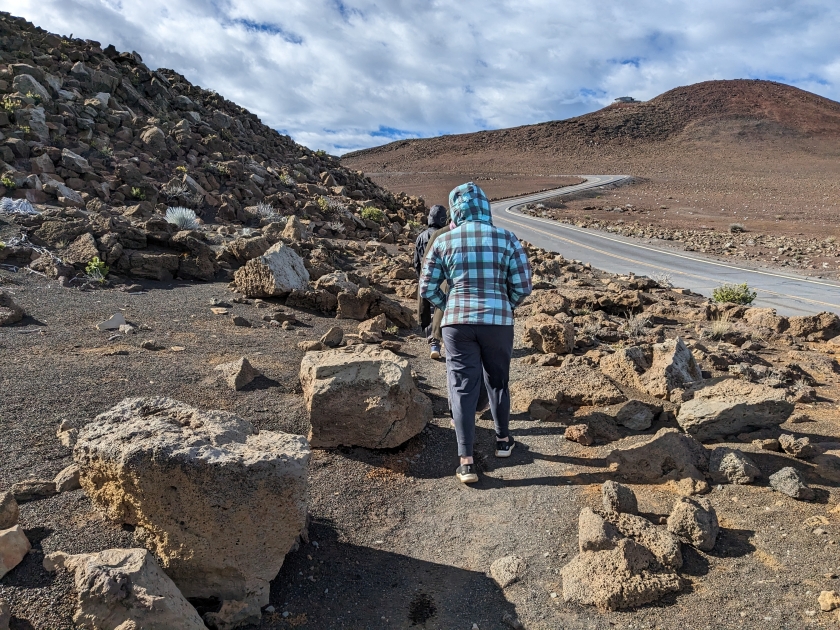 people walking on trail in Haleakala national Park volcano in Maui hawaii