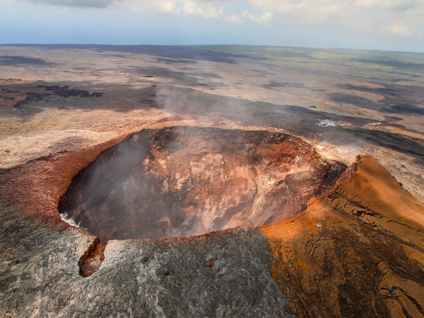 The smoking crater of Mauna Loa volcano on the Big Island, Hawaii archipelago, in Volcanoes National Park, after the eruption of lava in the summer of 2018, from the air