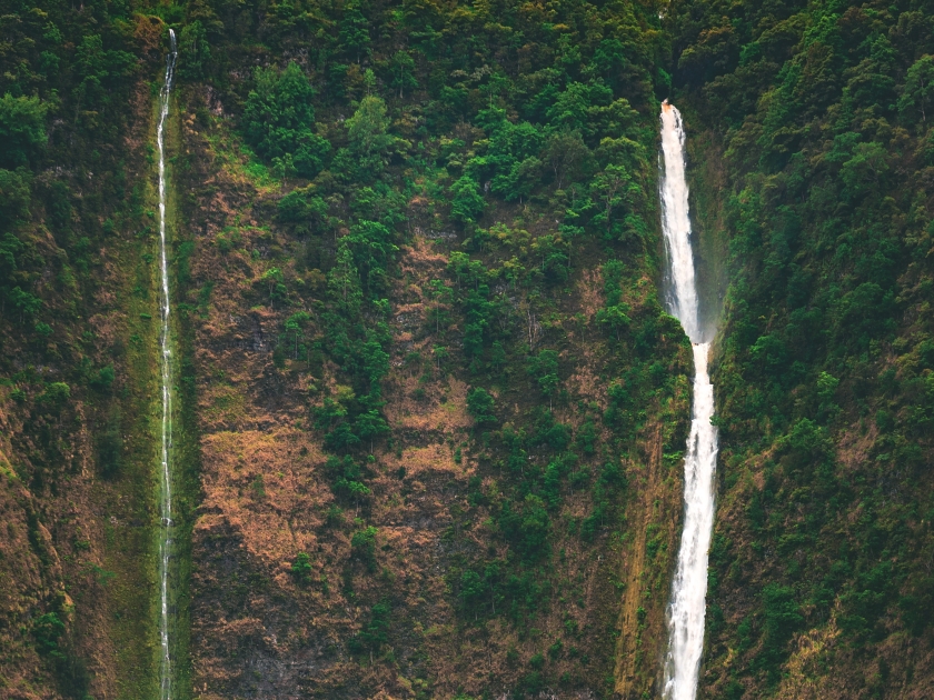 Hiilawe Falls, the biggest and tallest waterfall in the state that feeds the river winding through Waipio Valley in the Hamakua district on the north shore of the big island of Hawai'i, United States.