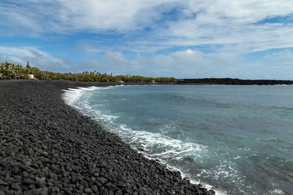 New black sand beach at Isaac Hale Beach Park created by 2018 eruption and lava flow of Kilauea volcano on the Big Island of Hawaii, USA