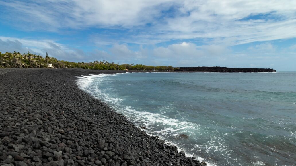 New black sand beach at Isaac Hale Beach Park created by 2018 eruption and lava flow of Kilauea volcano on the Big Island of Hawaii, USA