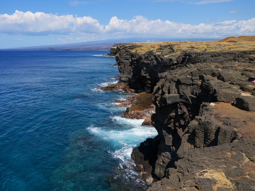 Volcanic cliffs in South Point Park, the southernmost point of the United States on the Big Island of Hawaii in the Pacific Ocean