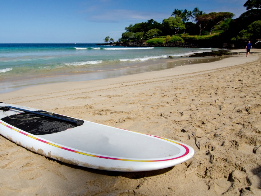 Forgotten surfboard at Mauna Kea Beach, Big Island, Hawaii