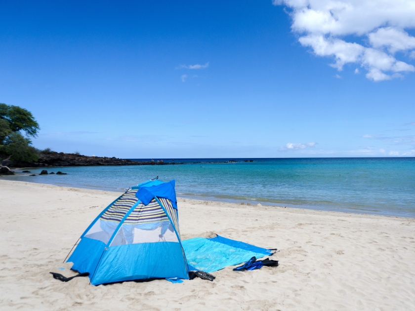 Blue tent on Kaunaoa beach, Big Island, Hawaii