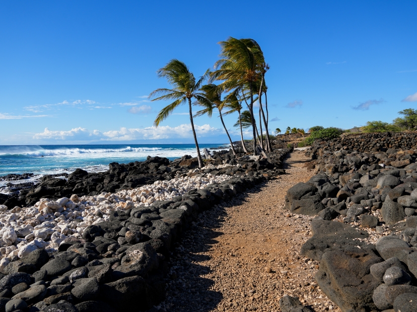 Rocky coastal trail path following the Pacific Ocean in the ancient fishing village in ruins of the Lapakahi State Historical Park on the island of Hawai'i (Big Island) in the United States