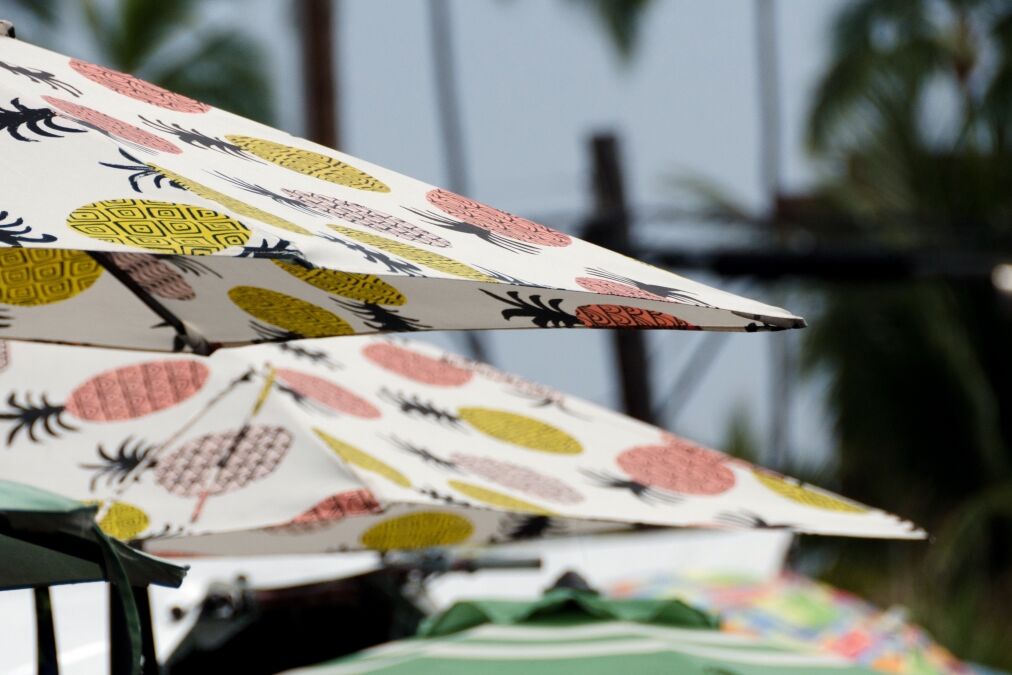 Colorful umbrellas on overcast afternoon at Kona Farmer Market, Kailua Kona, Big Island