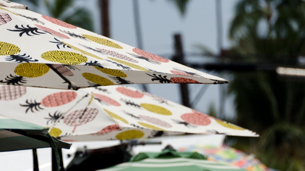 Colorful umbrellas on overcast afternoon at Kona Farmer Market, Kailua Kona, Big Island