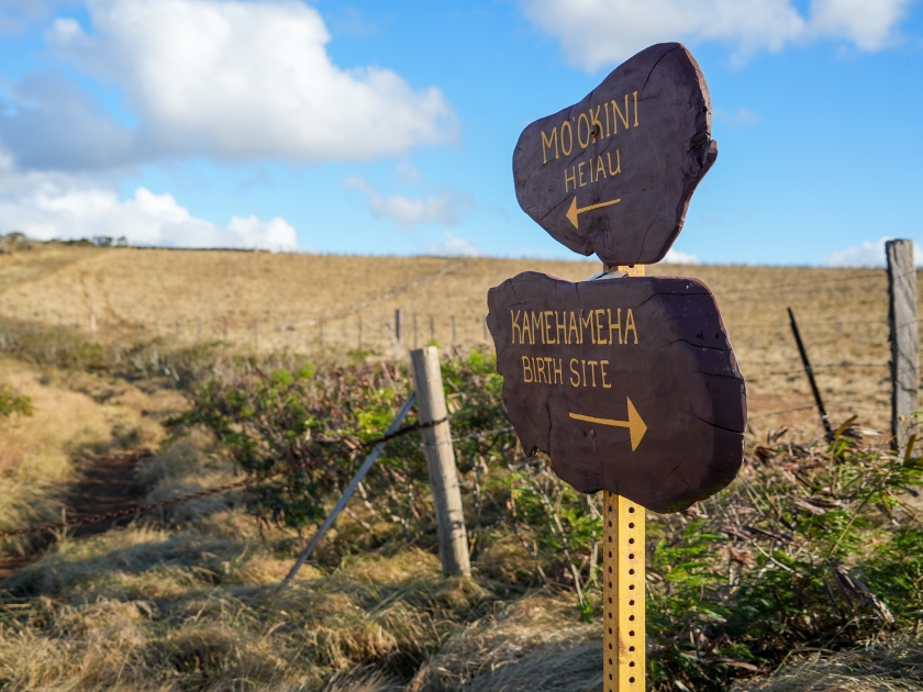 Direction signs to Mo'okini Heuiau and Kamehameha birth place in the north of Big Island, Hawaii - Coastal trail in the Kohala Historical Sites State Monument near Upolu Point