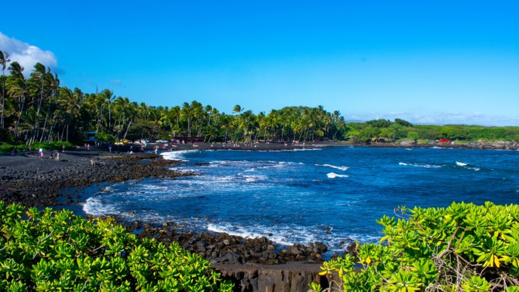 Sunny day at Punalu'u Black Sand Beach on the Big Island. Island of Hawaii, Hawaii, USA.