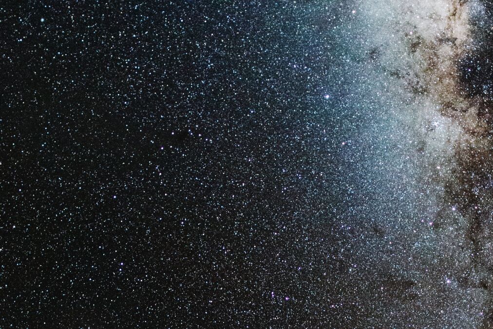 View of Milky Way solar system in night sky over volcanic pu'u hill on the slope of sacred Mauna Kea mountain in Hawaii