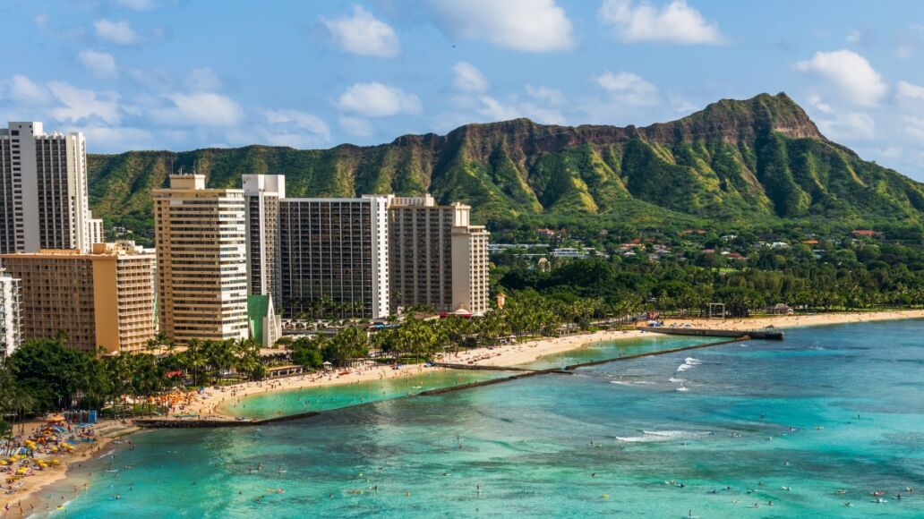 Hawaii panoramic Honolulu city travel landscape banner background of Waikiki beach and Diamond Head mountain peak at sunset, Oahu island, USA vacation.