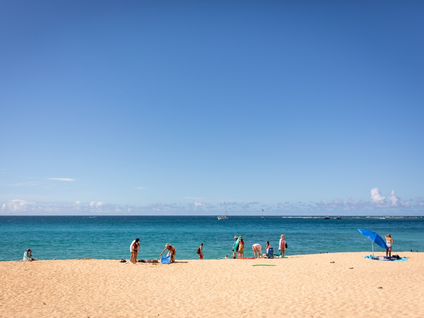 Haena Beach Park, Kauai US - July 20, 2024: a beautiful sandy Haena Beach park full of people on the North Shore of Kauai, Hawaii on a sunny day