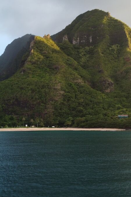 Ha'ena Beach, Kauai: Bask in the golden hour's warm embrace, as the sun casts a radiant glow over the pristine shoreline, creating a picture-perfect moment. 🌅🏖️