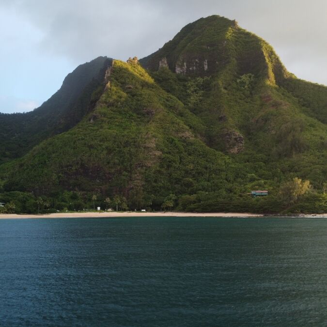 Ha'ena Beach, Kauai: Bask in the golden hour's warm embrace, as the sun casts a radiant glow over the pristine shoreline, creating a picture-perfect moment. 🌅🏖️