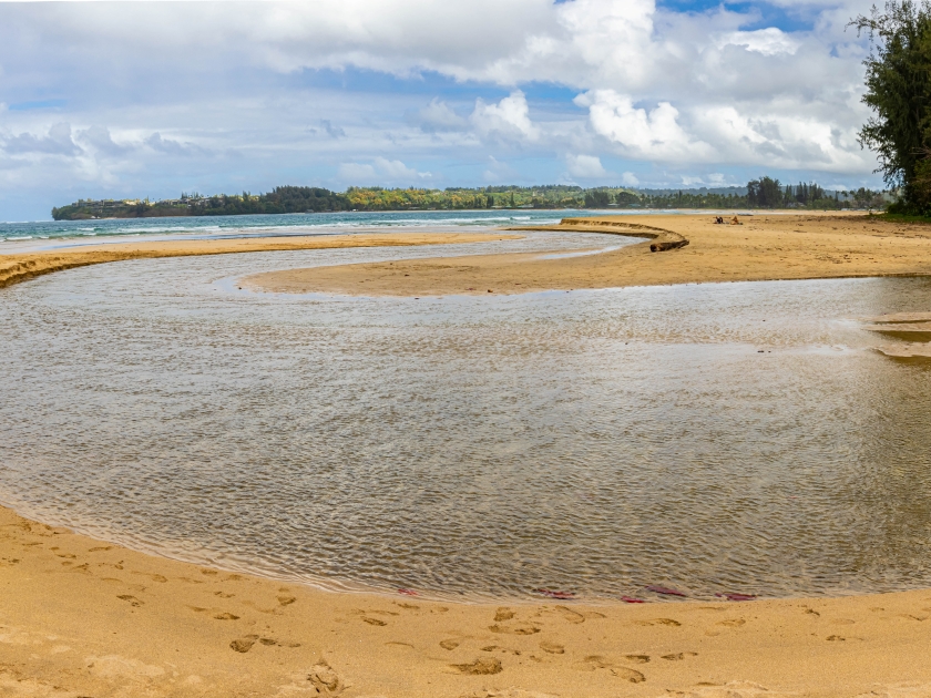 The Hanalei River Joining Hanalei Bay on Hanalei Beach, Hanalei, Kauai, Hawaii, USA