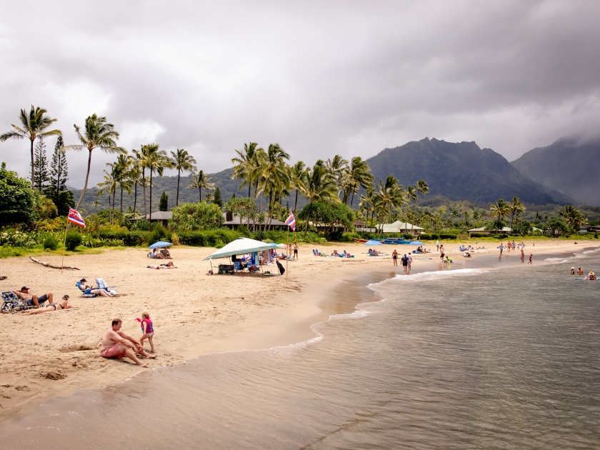 Hanalei, Hawaii US - July 28, 2024: Hanalei Bay beach, located along the western edge of Hanalei Bay at the end of Weke Rd, Kauai, full of tourist on a sunny day