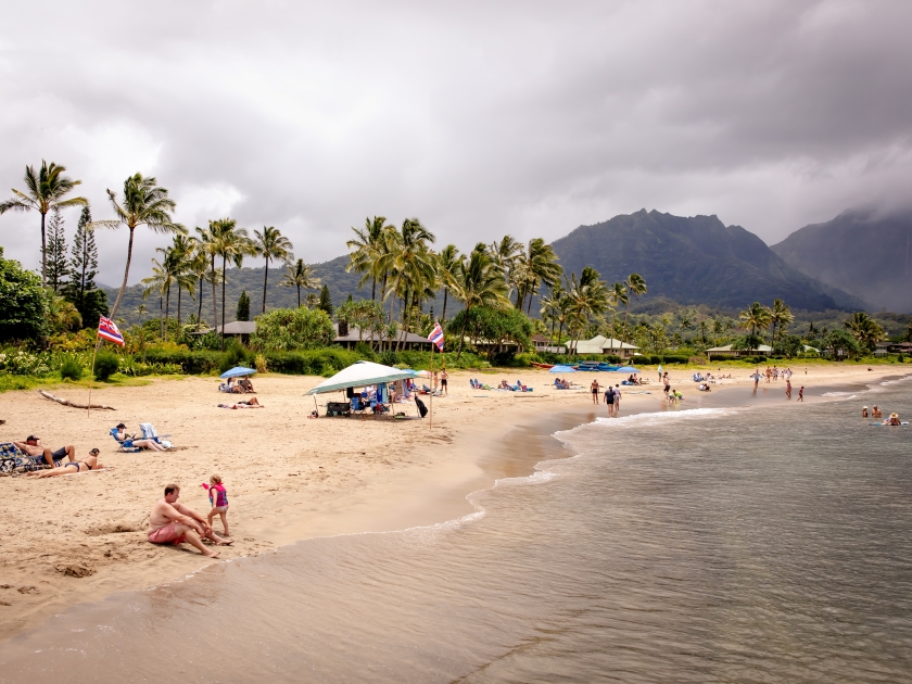 Hanalei, Hawaii US - July 28, 2024: Hanalei Bay beach, located along the western edge of Hanalei Bay at the end of Weke Rd, Kauai, full of tourist on a sunny day