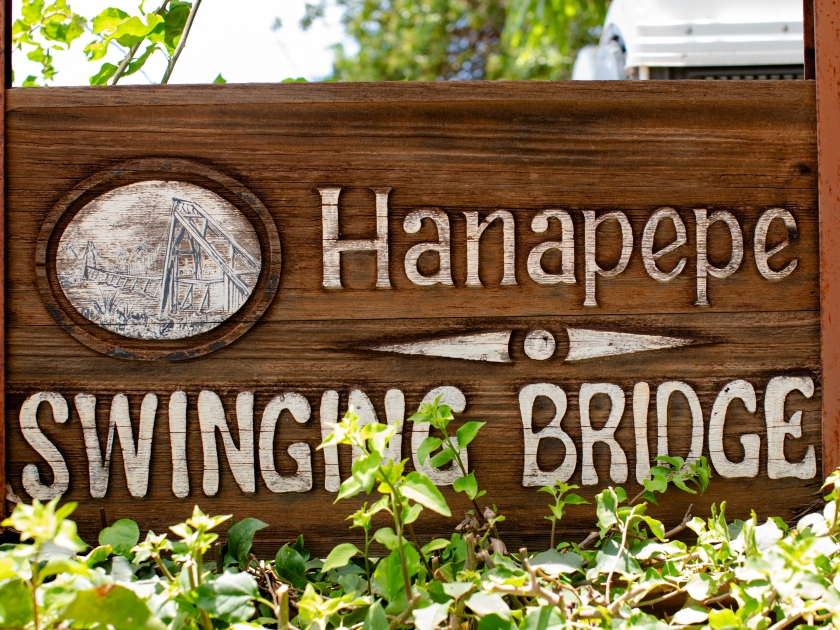 Information sign at the entrance to Hanapepe Swinging Bridge, Kauai, Hawaii on a sunny day, no people