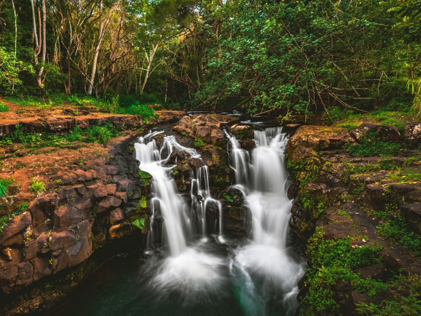 Ho'opi'i Falls, a set of waterfalls and popular hiking location and local swimming hole along Kapaʻa Stream, located near Kapaʻa town on the east shore of the island of Kauai, Hawaii, United States.