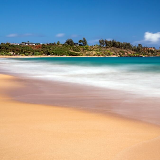 Day time long exposure at Kealia beach on the tropical island of Kauai, Hawaii