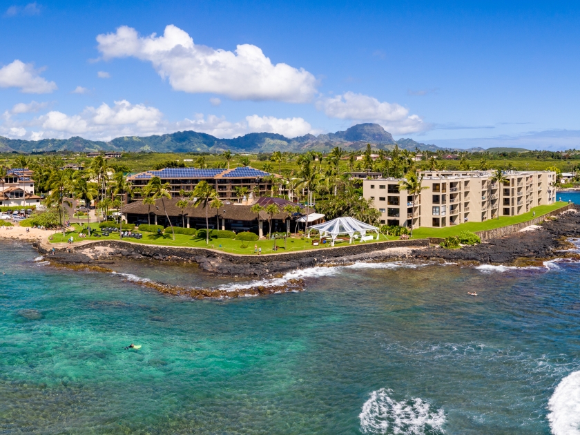 Wide panorama of the coastline around Lawa'i beach near Poipu on the south coast of Kauai