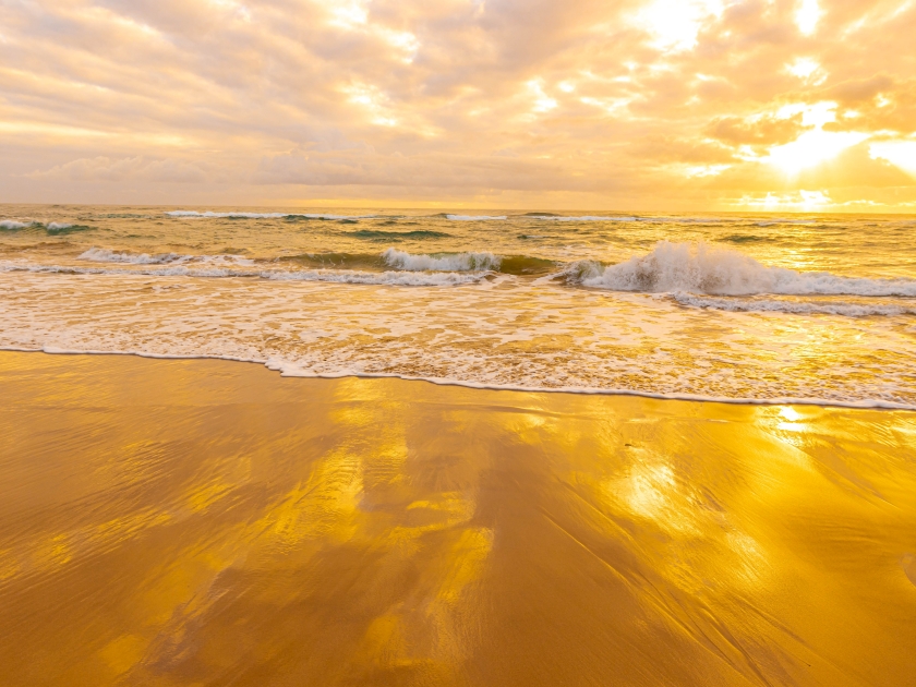 Golden Sunrise on The Sandy Shores of Lydgate Beach, Lydgate Beach Park, Kauai, Hawaii, USA