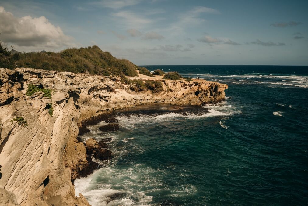 A view of the Pacific Ocean from the cliffs of the Mahaulepu Heritage Trail in Poipu, Kauai, Hawaii, USA. High quality photo