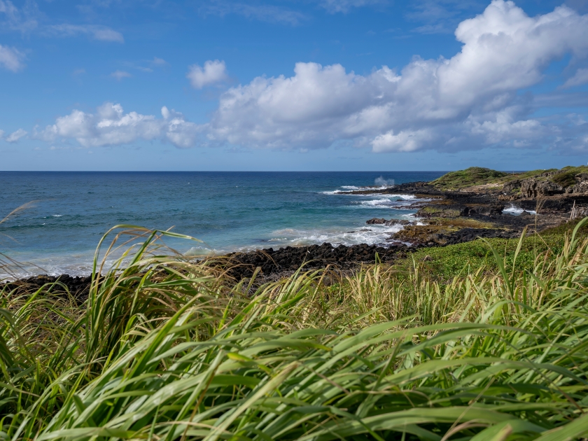 Warm sunshine and cool Pacific Ocean breezes along Shipwreck Beach and the Maha'ulepu Heritage Trail in Koloa, Hawaii, USA