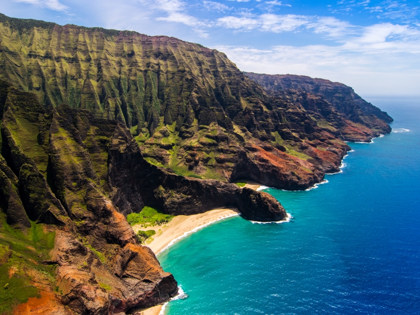 Aerial landscape view of Honopu Arch at Na Pali coastline, Kauai, Hawaii, USA