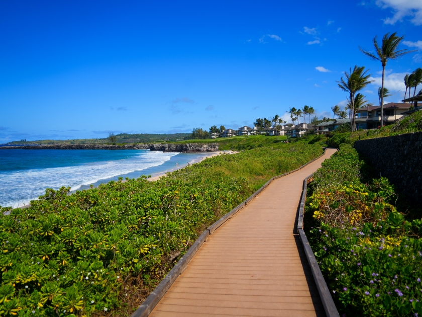 Oneloa Beach along the Kapalua Coastal Trail on West Maui, Hawaii - Boardwalk winding between luxury resorts and the Pacific Ocean