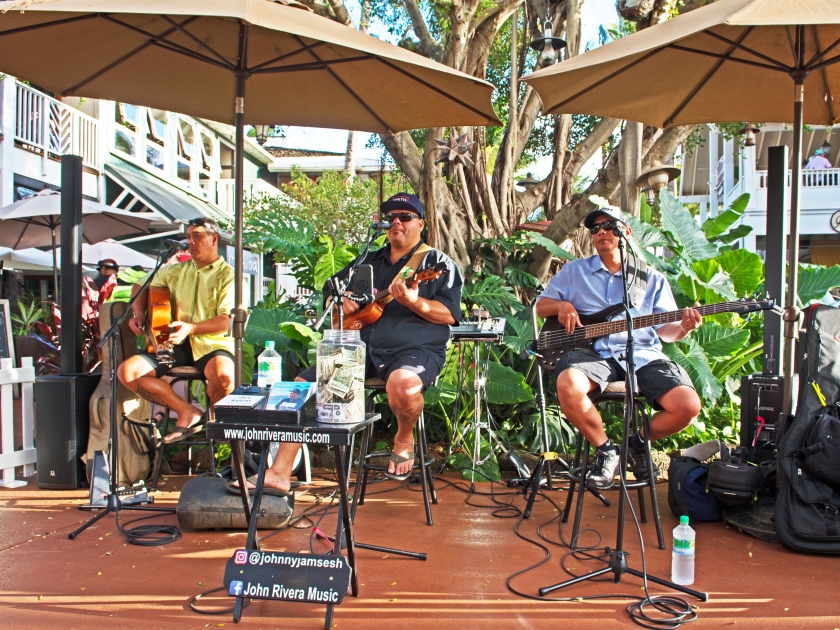 Poipu, Hawaii/USA - January 8 2020: musicians entertain shoppers visiting the culinary market hosted by the Shops at Kukui'ula.