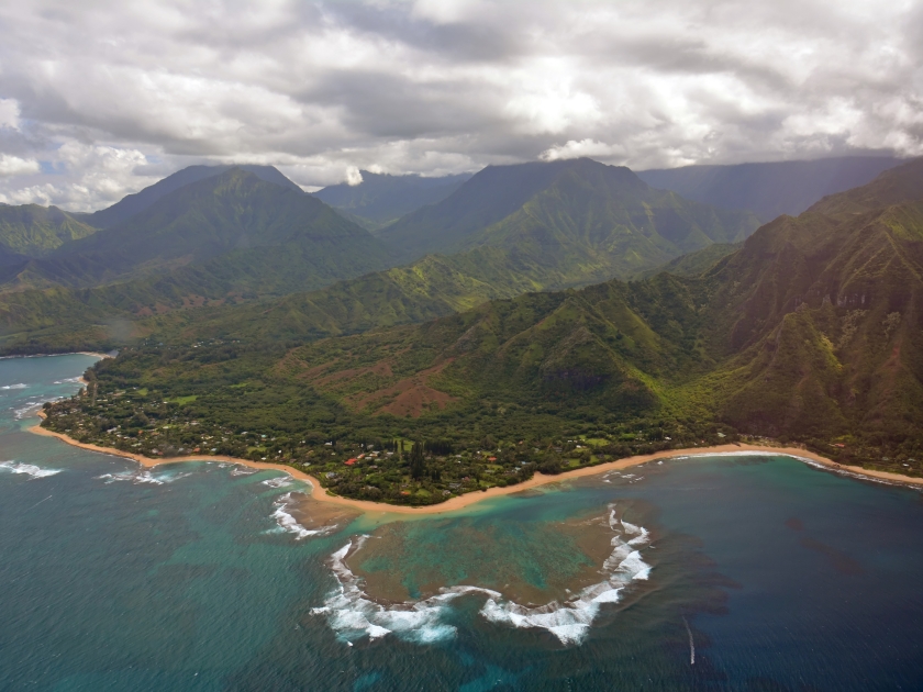 the town of princeville and coral reefs on the north shore of kauai, hawaii, as seen from a helicopter