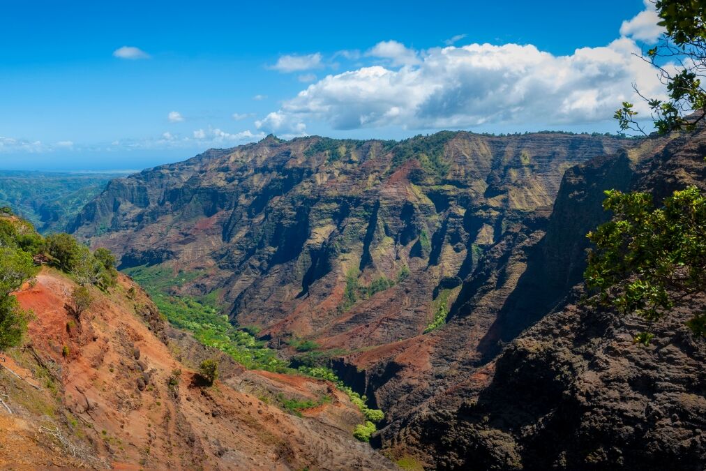 Waimea Canyon, Kauai, Hawaii. Waimea Canyon, on Kauai's West Side, is described as “The Grand Canyon of the Pacific.” The canyon is 14 miles long, 1 mile wide and more than 3,600 feet deep.