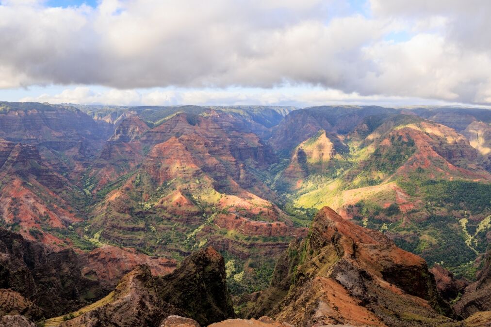 Waimea Canyon shows great contrast of red and greens making a gorgeous mosaic of color in Kauai, Hawaii