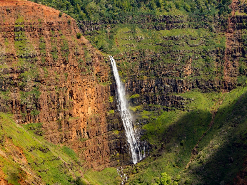 Waipoo falls in Waimea Canyon, also Grand Canyon of the Pacific. It is a large canyon, approximately ten miles long and up to 3,000 feet deep, located on the western side of Kaua Hawaii