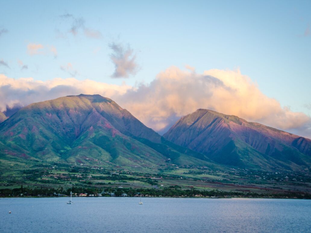 Clouds hover over the West Maui Forest Reserve and Mountains.