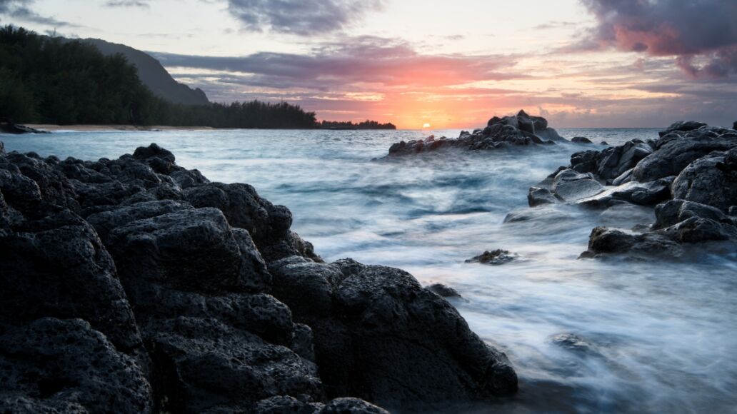 Kauapea Beach, also known as secret beach, Kauai, Hawaii, at sunset