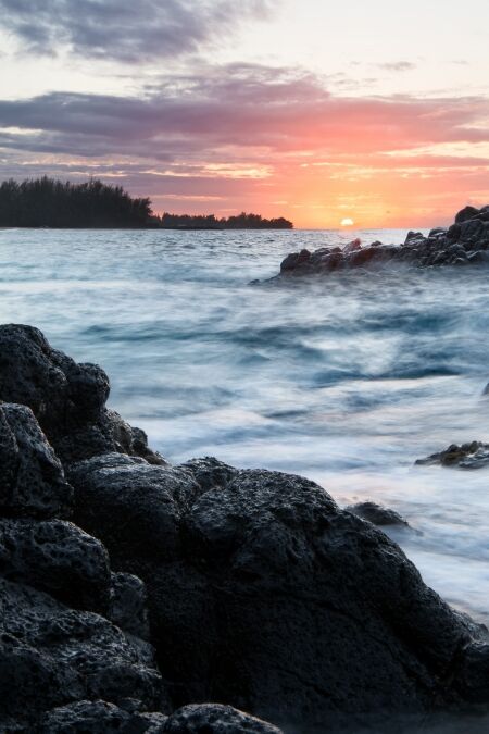 Kauapea Beach, also known as secret beach, Kauai, Hawaii, at sunset