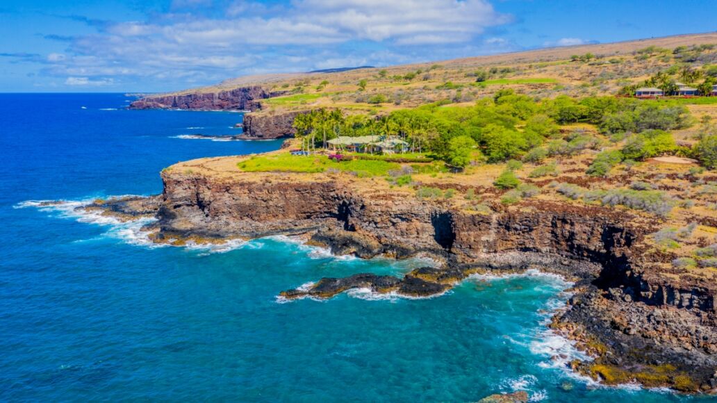 Aerial view of Lanai, Hawaii looking west towards Golf Course, bordering the Pacific Ocean