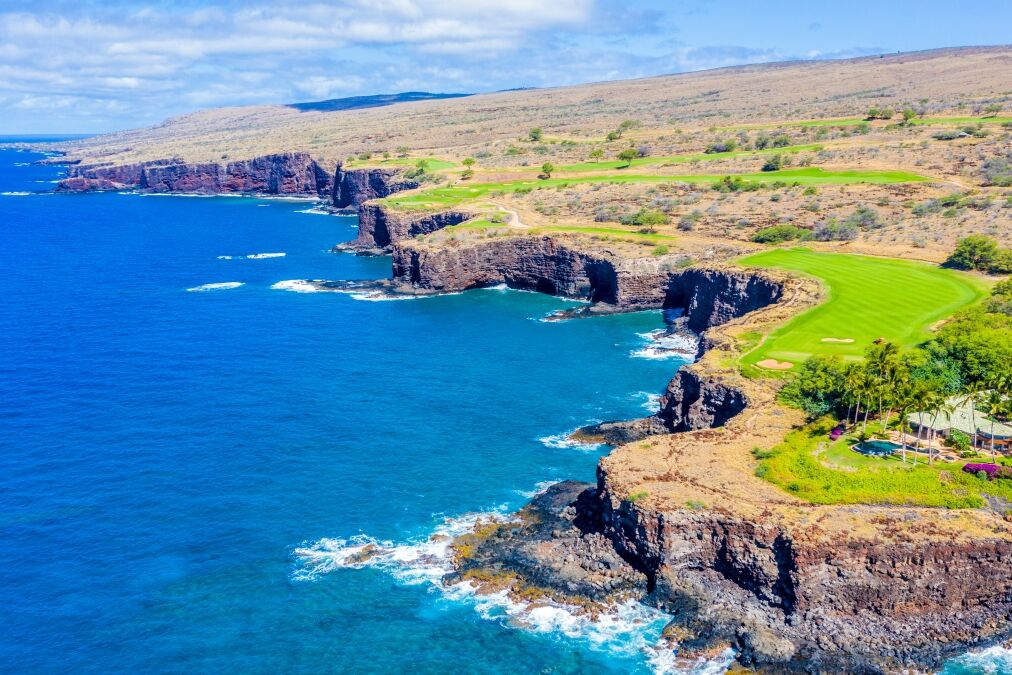 Aerial view of Lanai, Hawaii looking west at the rocky cliffside bordering the Pacific Ocean