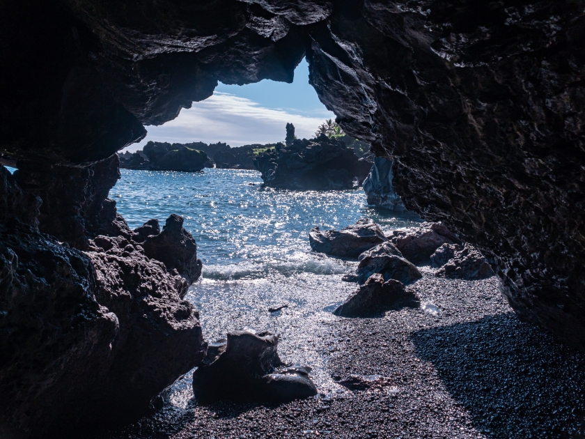 View of and from the Black Sand Beach from a Sea Cave