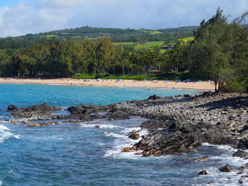 D.T. Fleming Park beach as seen from Makaluapuna Point in West Maui, Hawaii - Rocky coastline with high surf in the Pacific Ocean